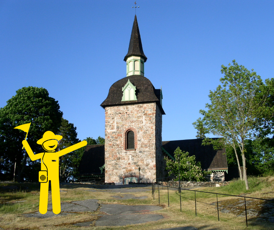 bild på föglö kyrka med en gul guide karaktär